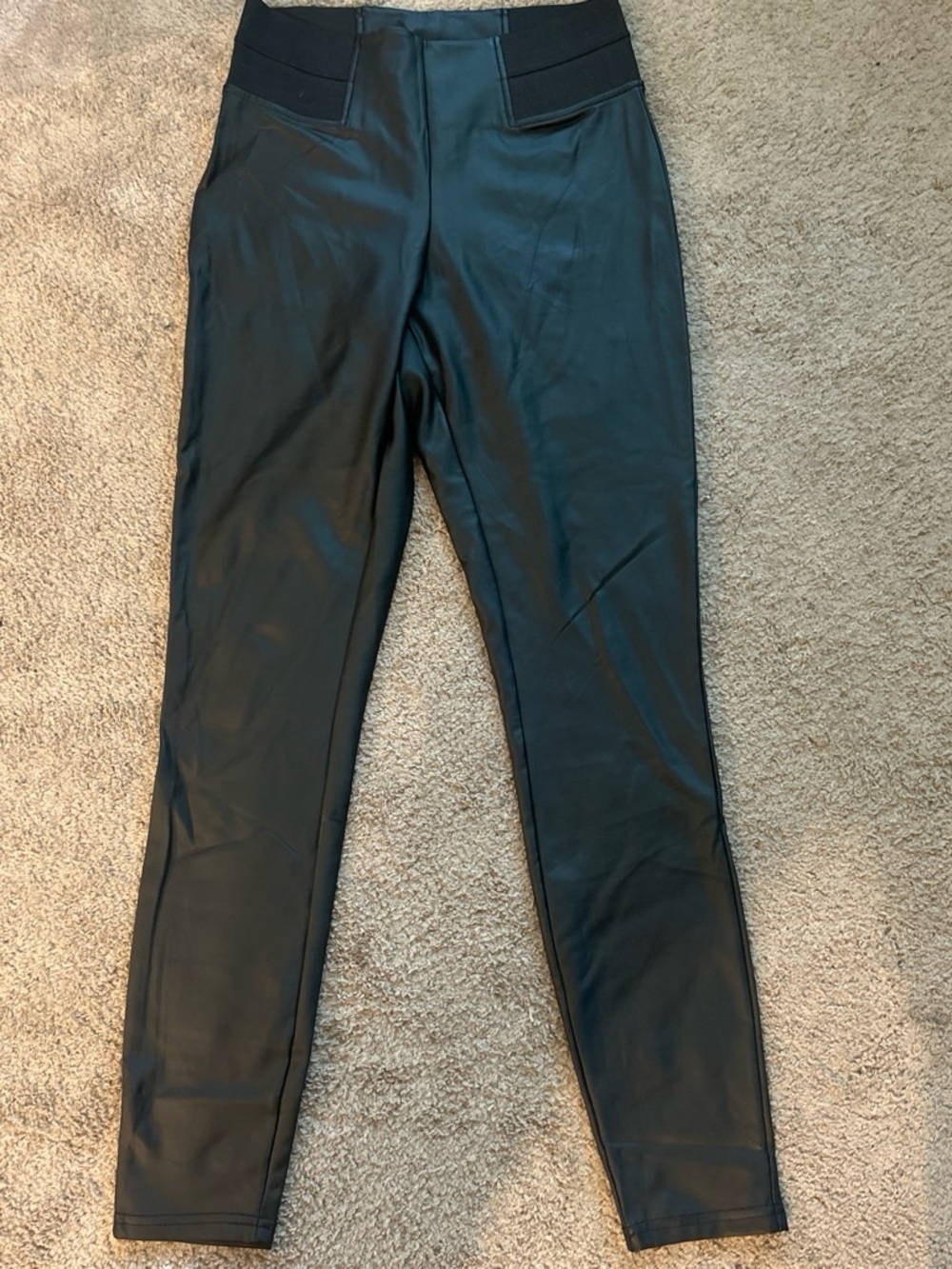 Label on faux leather pants